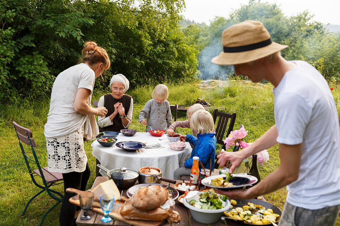 Family having meal in garden