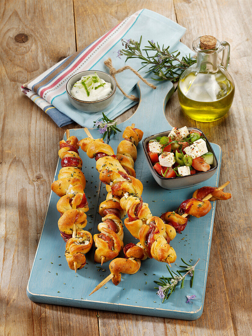 Grilled dough skewers with parma ham and garlic