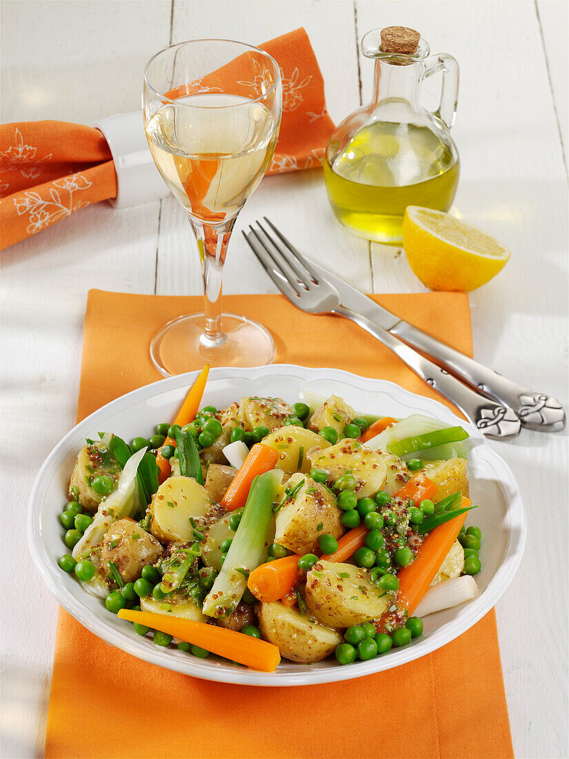 Warm potato salad with spring vegetables