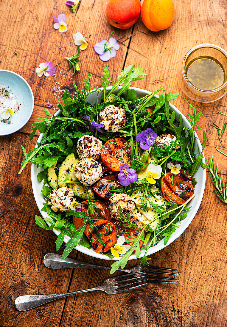 Summer rocket salad with grilled apricots and herb goat cheese balls