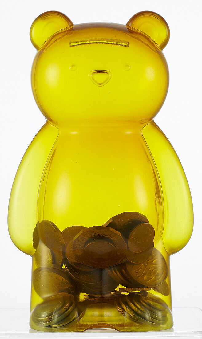 Teddy bear money box, half filled