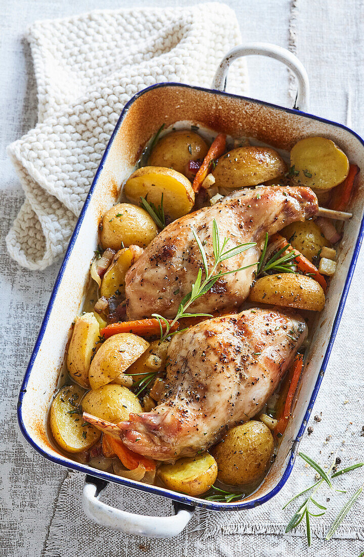 Baked rabbit legs with potatoes and mustard