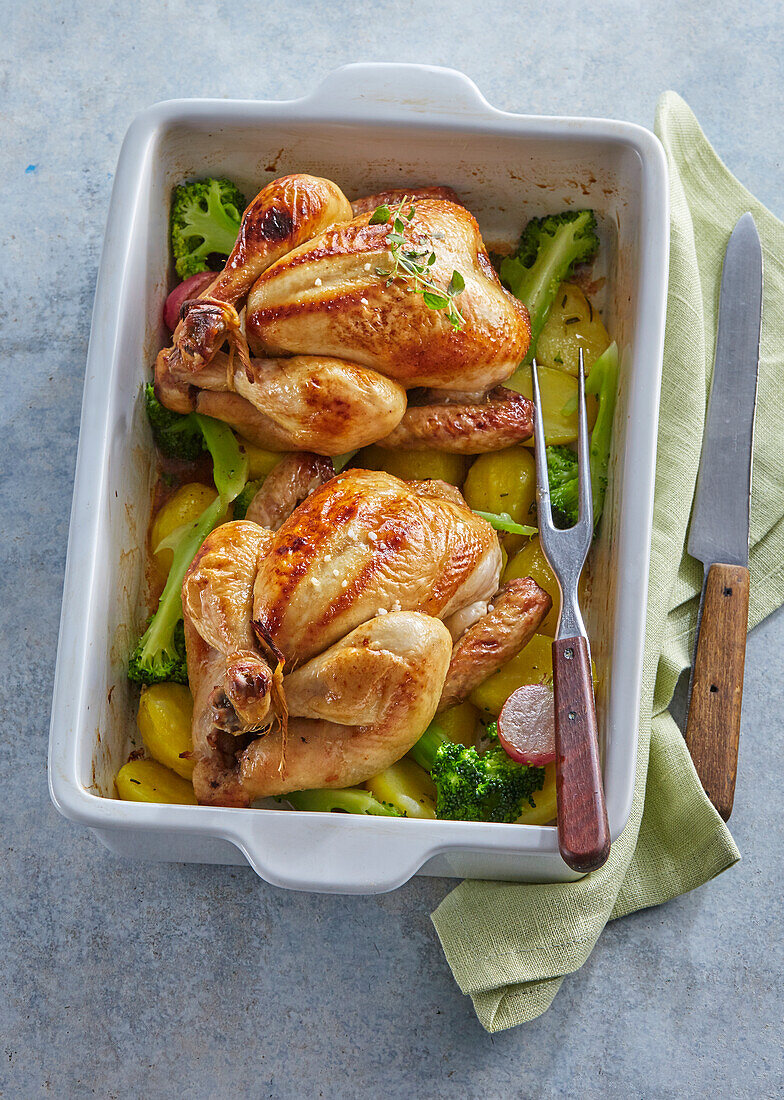Baked spring baby chickens with broccoli and radish