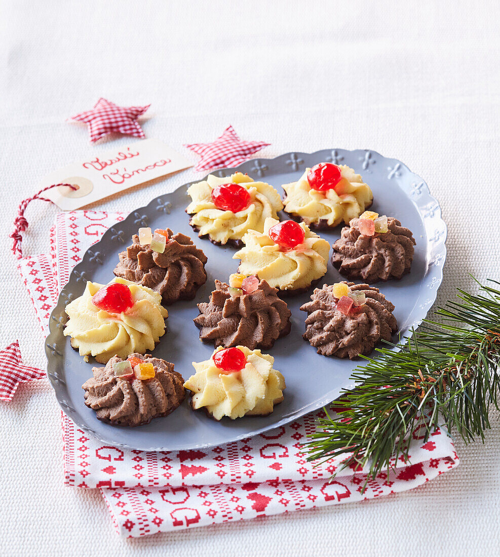 Black and white Christmas cookies with candied fruits