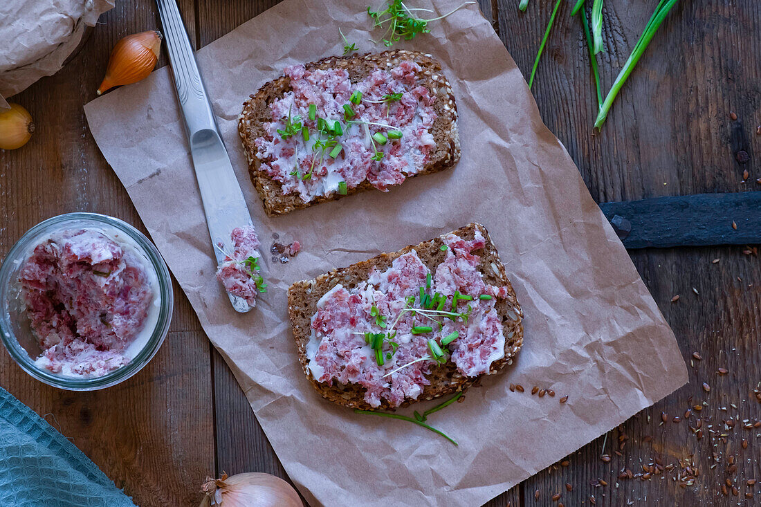 Wholegrain toast with homemade ham salad and herbs