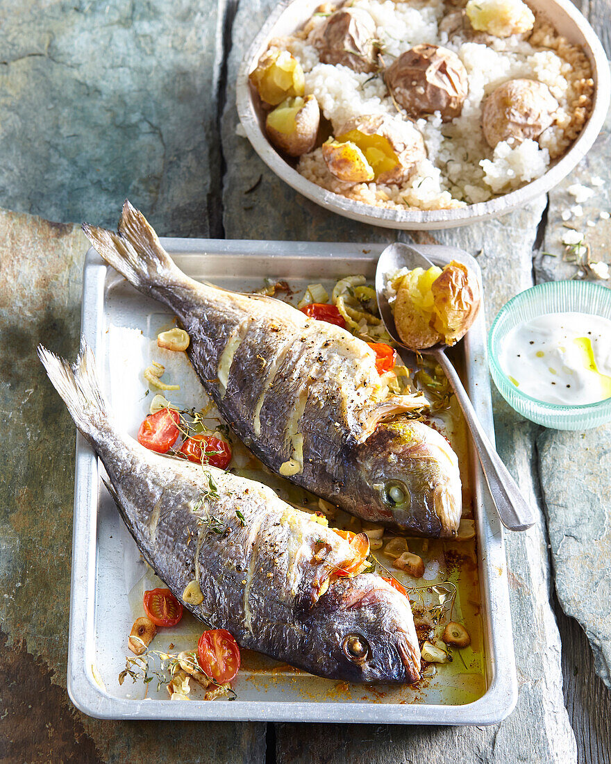 Baked breams with fennel and potatoes in salt crust