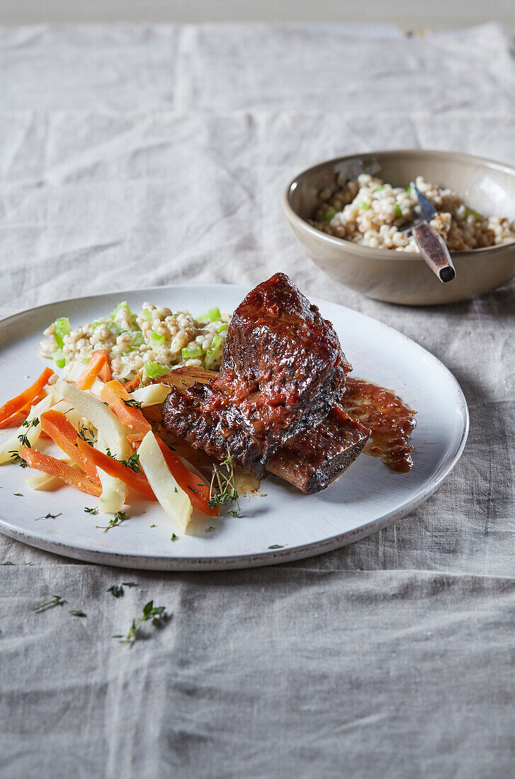 Beef ribs with vegetable sauce and barley groaths