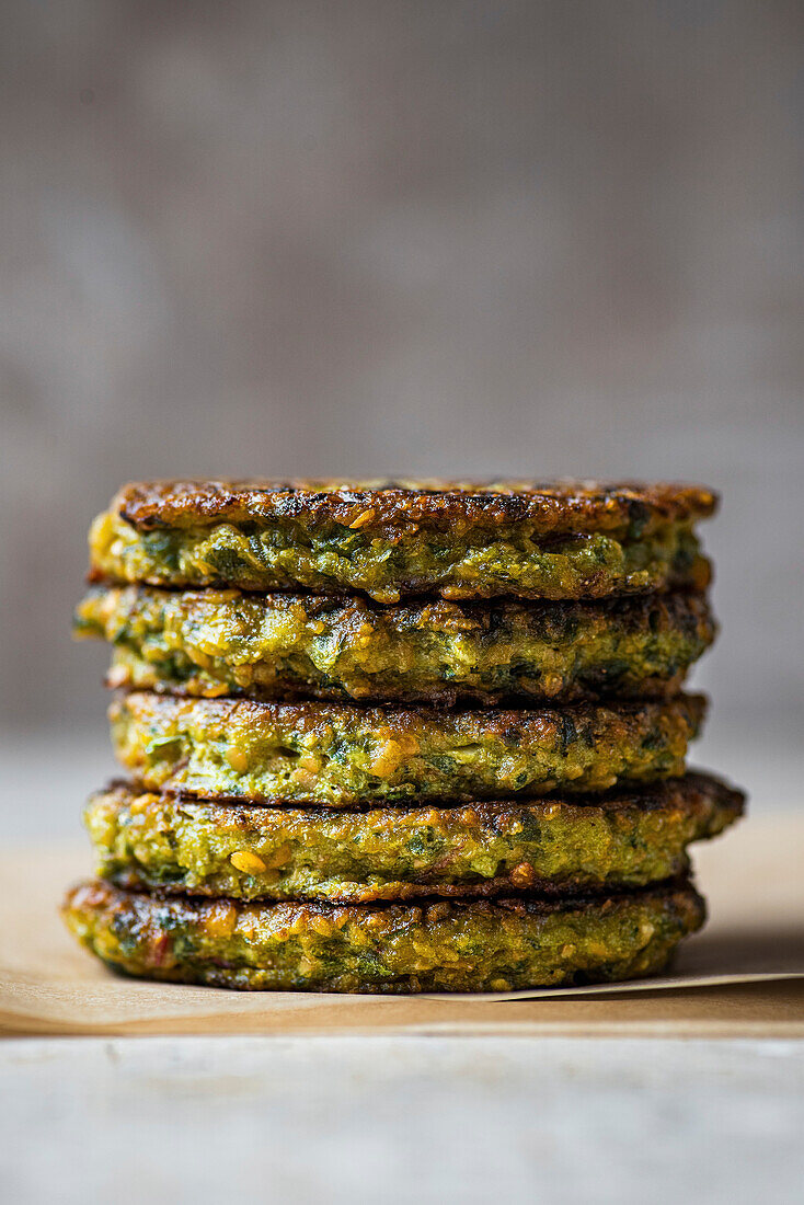 Lentil and Greens Patties stacked with copy space