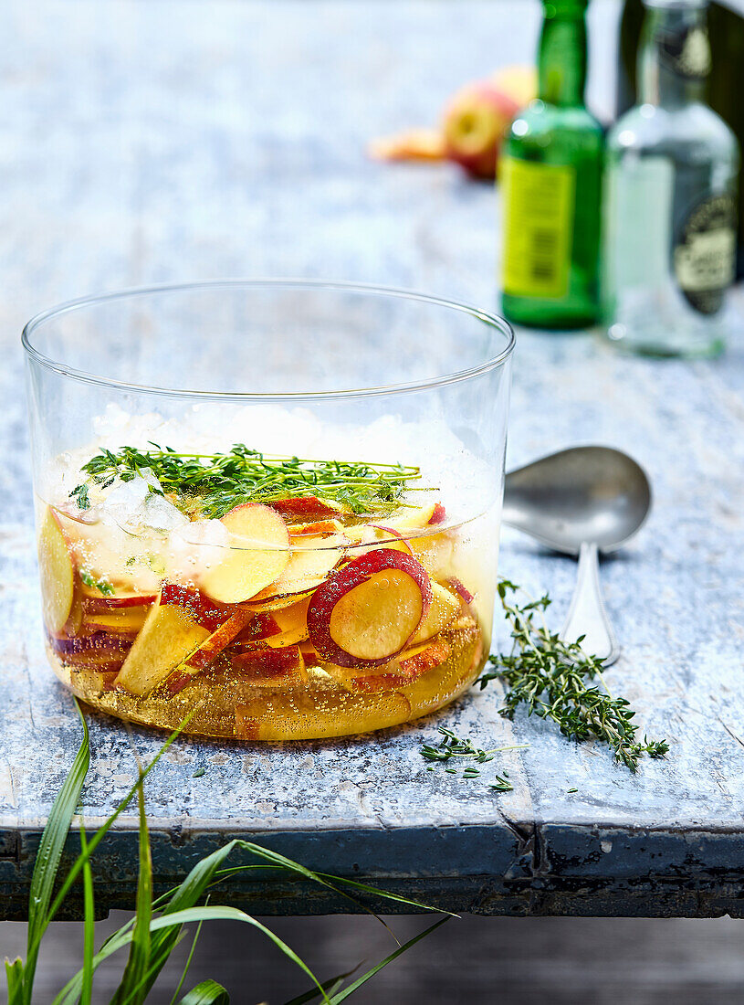 Bowle made from cider, nectarines and thyme