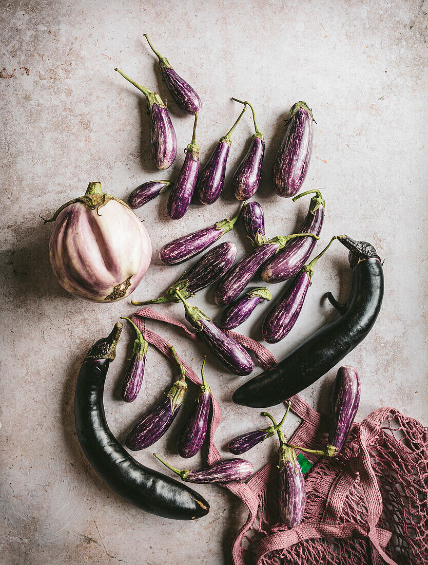 A flatlay of three varieties of eggplants