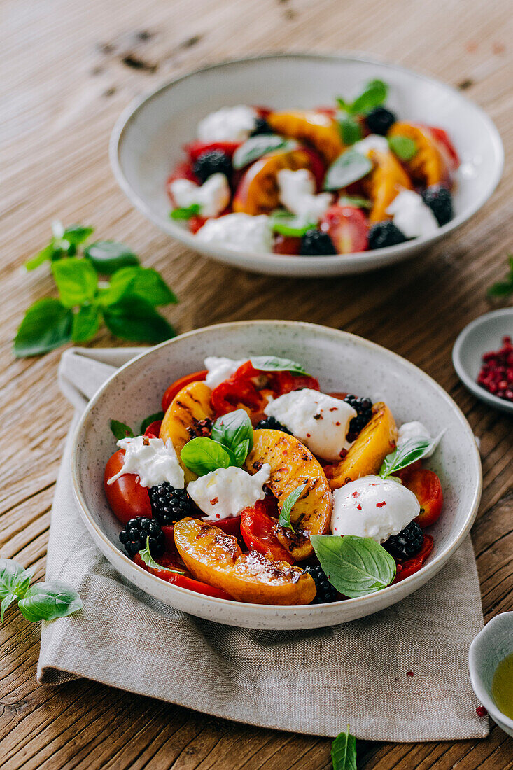 Tomato and peach salad with burrata and blackberries