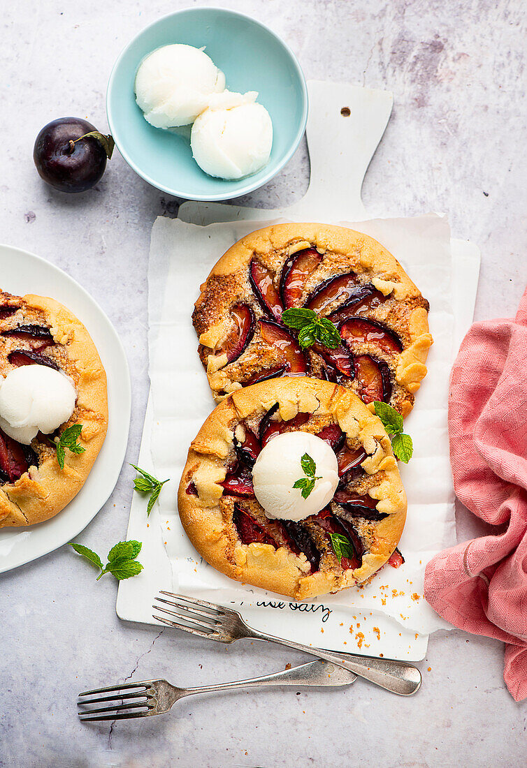Mini galettes with plums and lemon ice cream