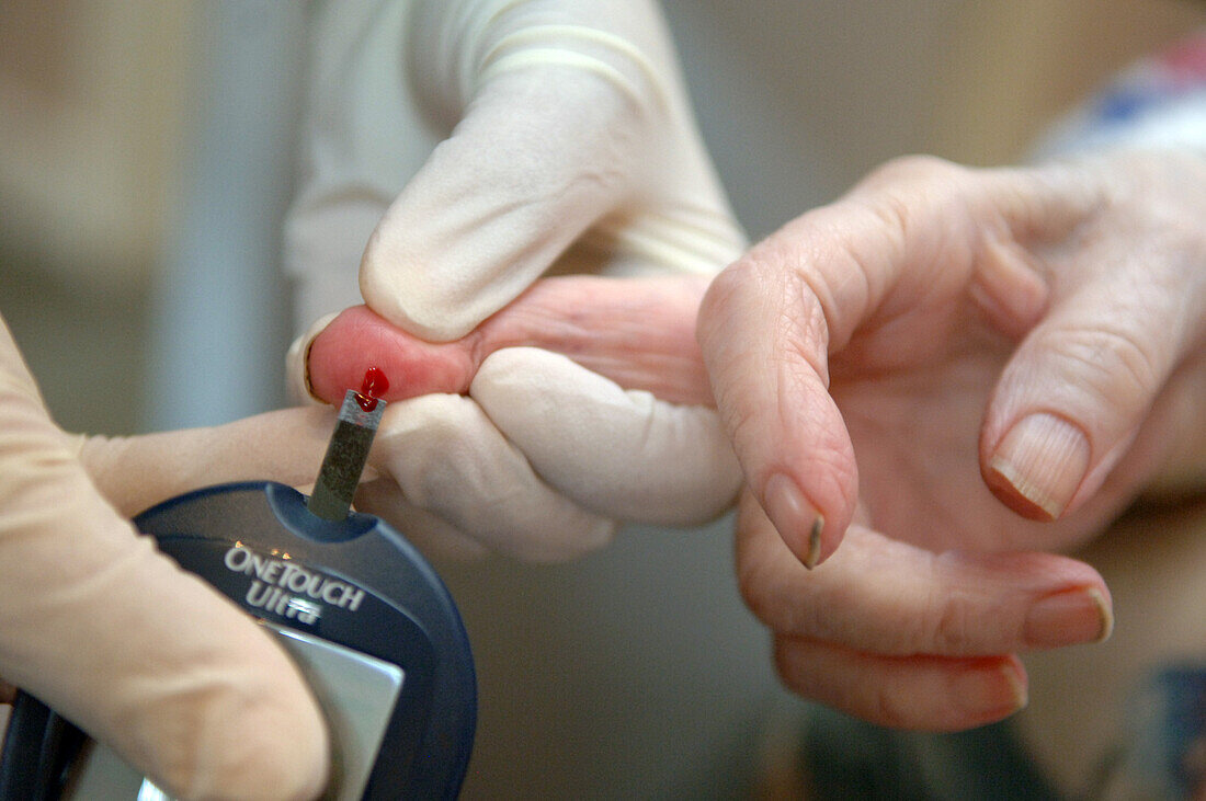 Paramedic taking blood sample
