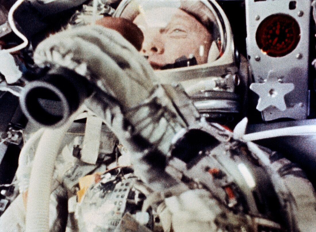 NASA astronaut John Glenn using binoculars