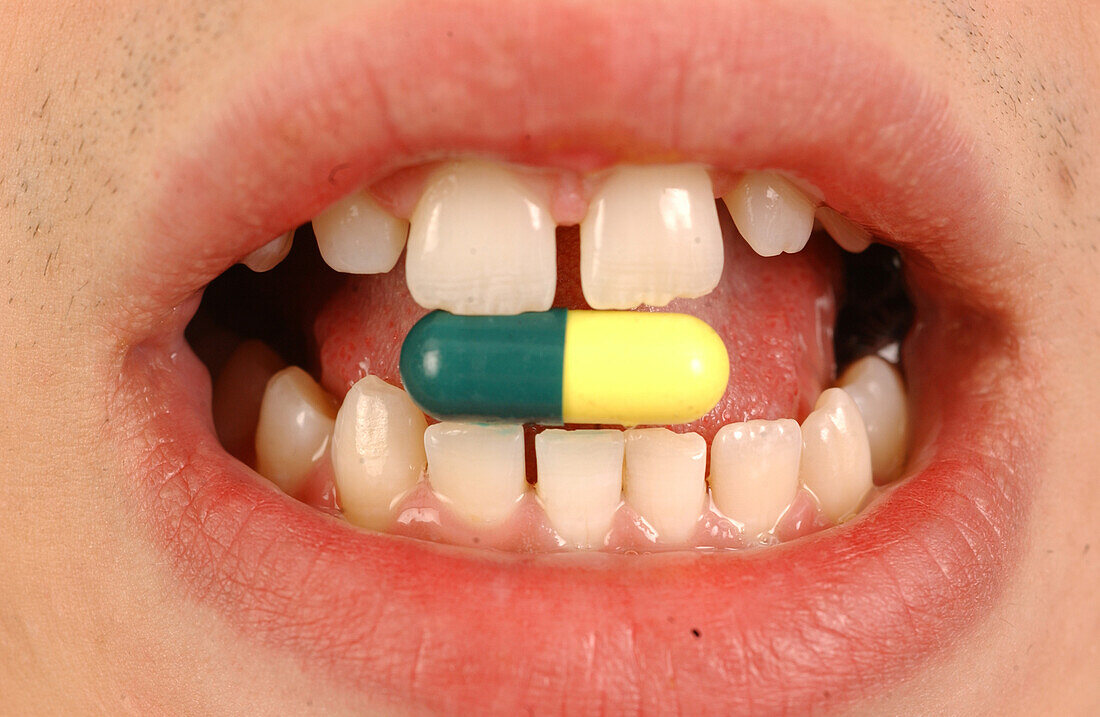 Person taking a pill