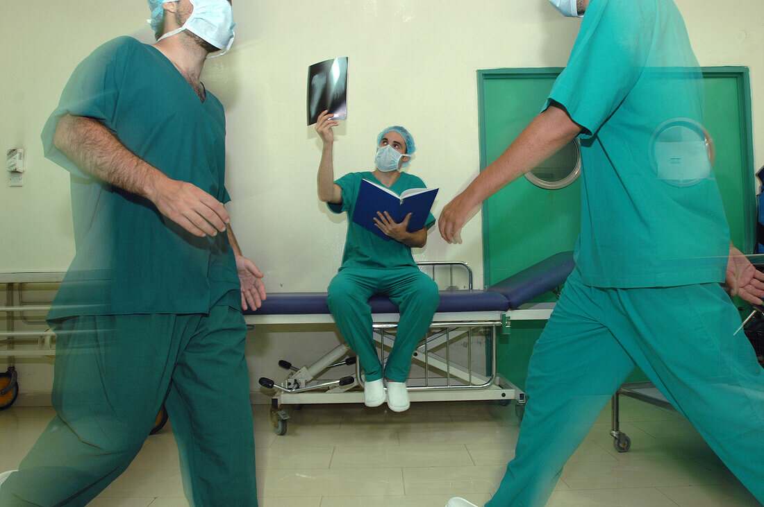 Surgeon examines an X-ray
