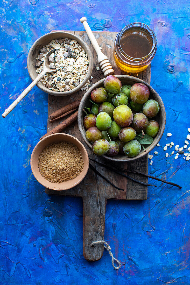 Plums, brown sugar and oatmeal for crumble