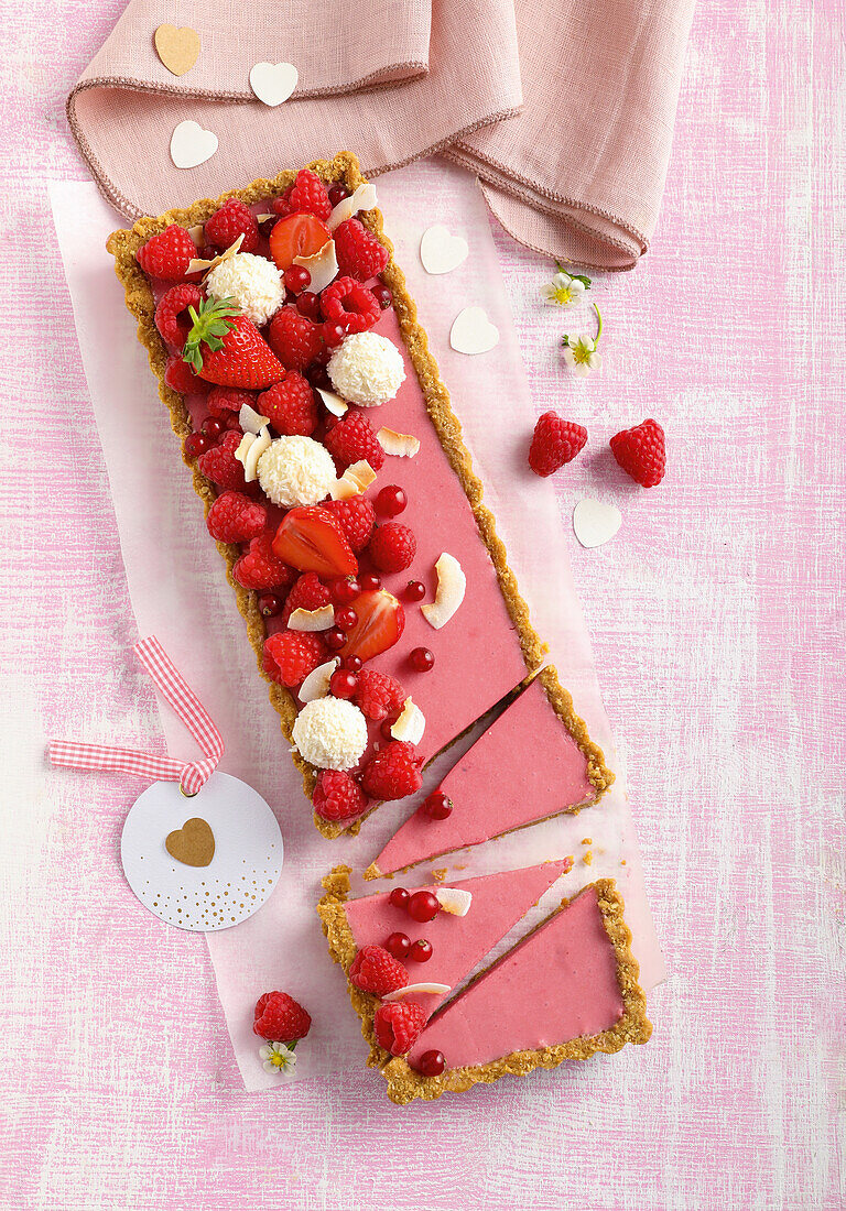 Raspberry mousse tart with coconut pralines