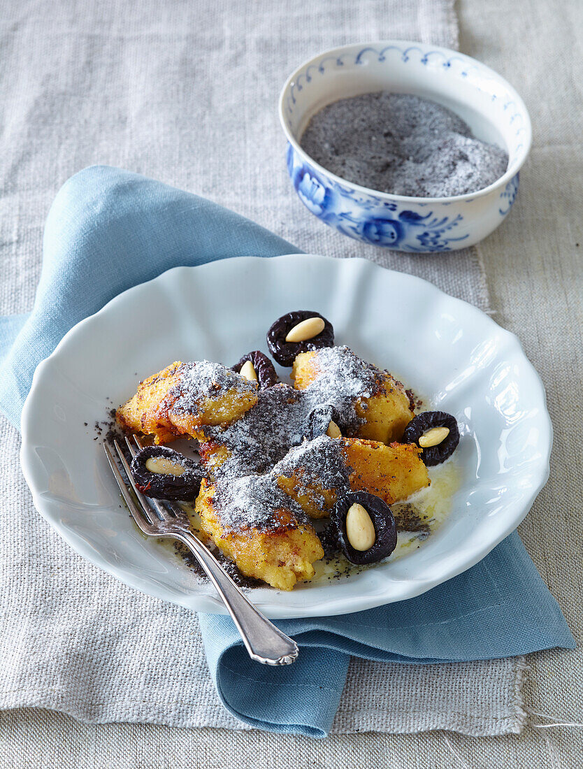 Mashed potatoes gnocchi with poppy seed and plums