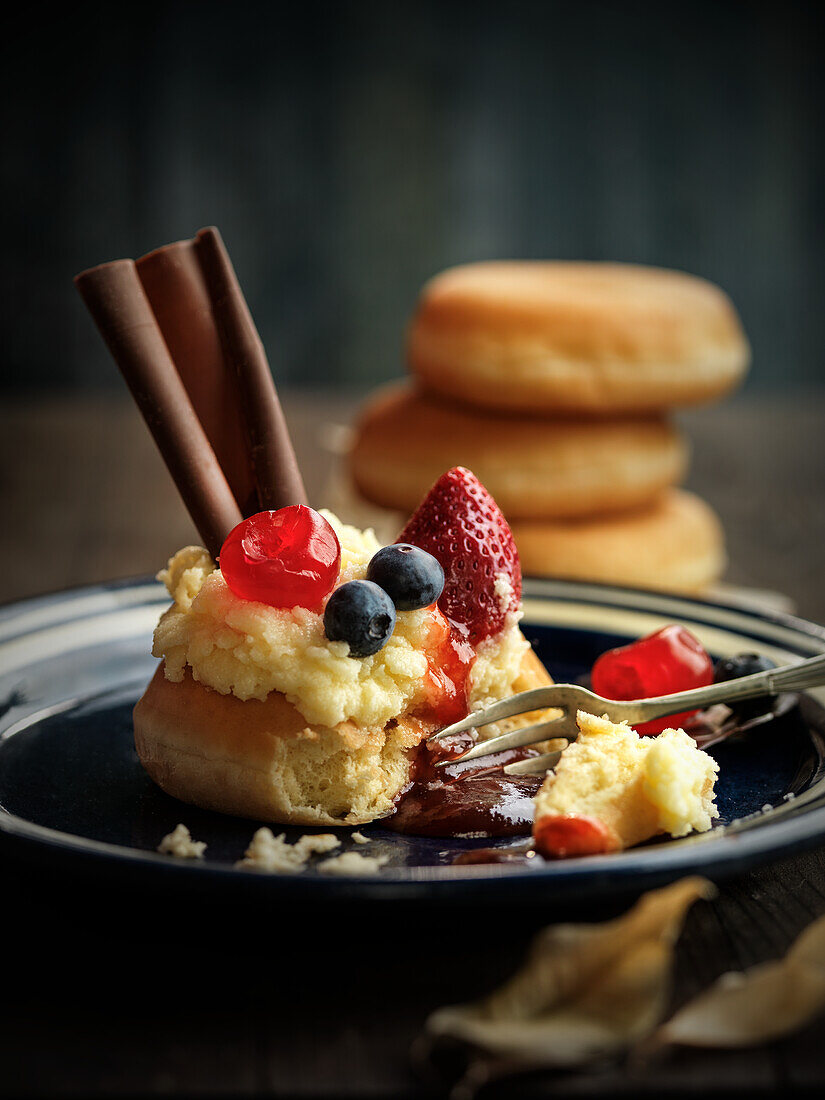 Donuts with vanilla cream and berries