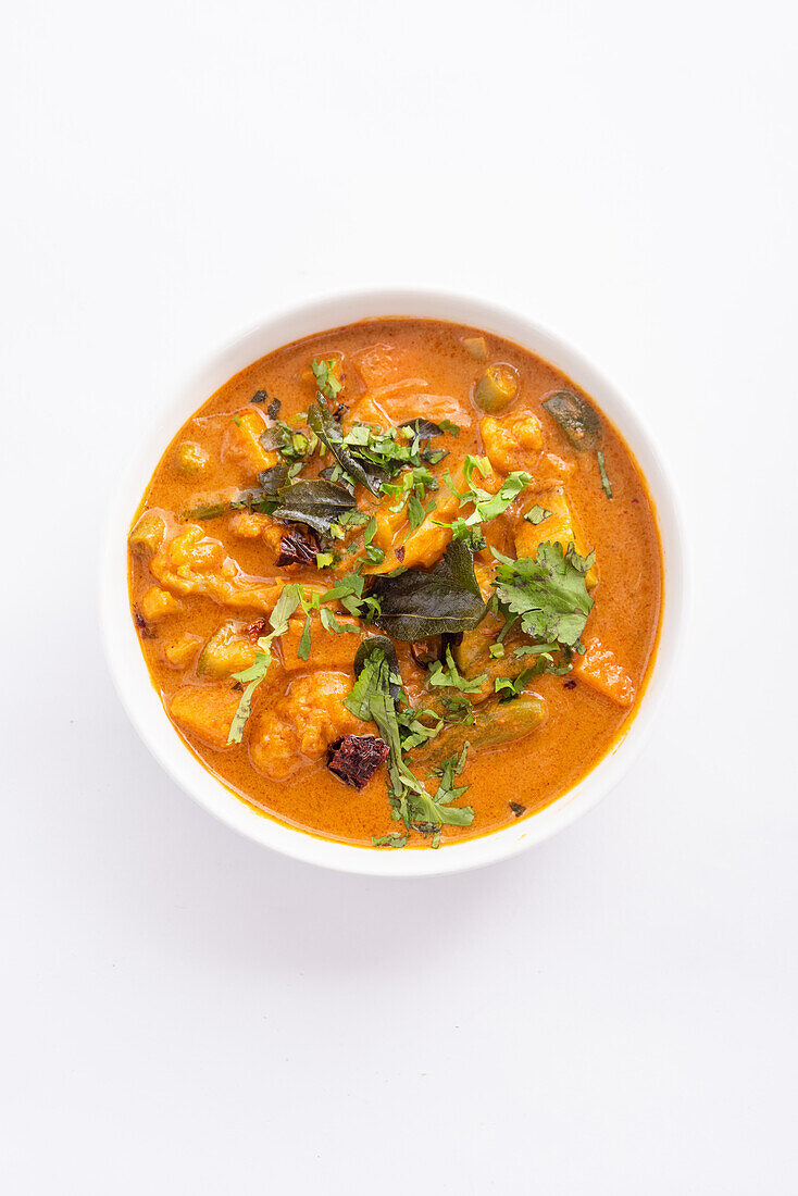 Goan vegetable curry on a white background (India)