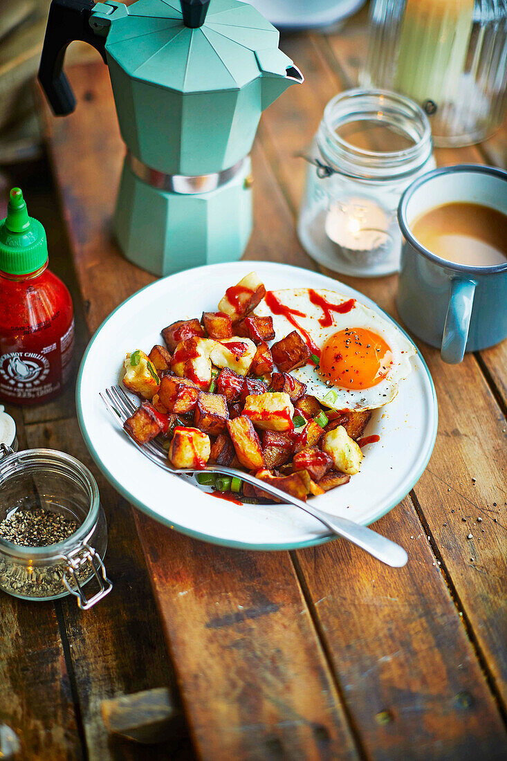 Hallouim hash with freid egg and Sriracha sauce