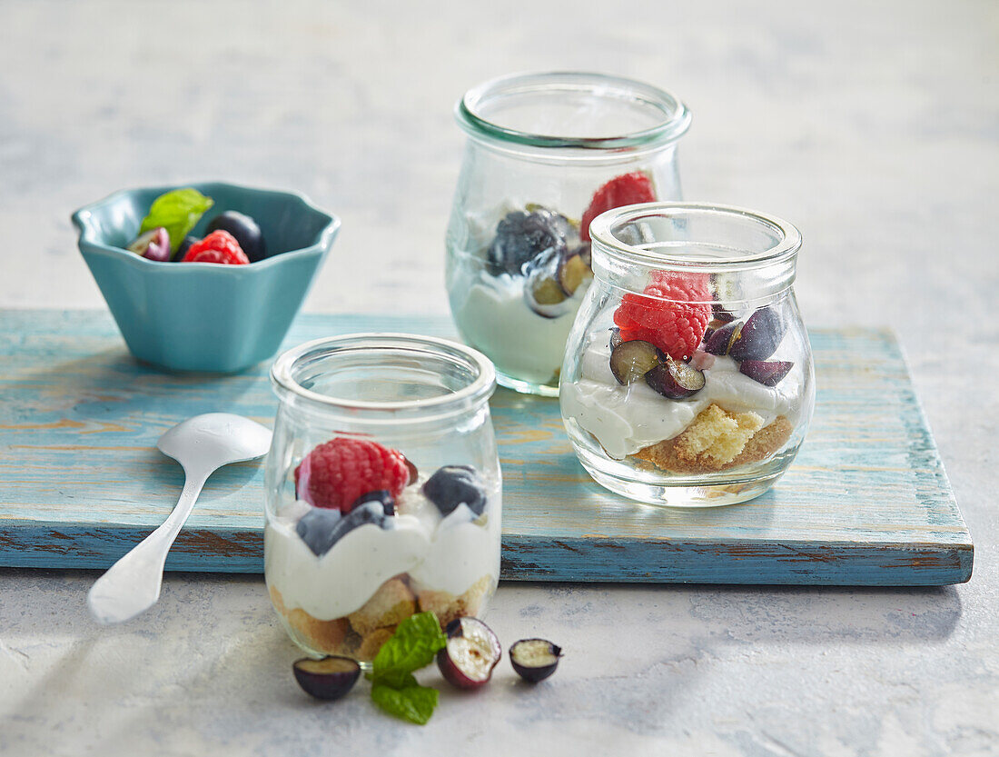 Curd cream with fruits and sponge biscuits