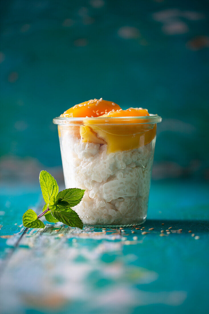 Thai coconut rice with mango and sesame seeds