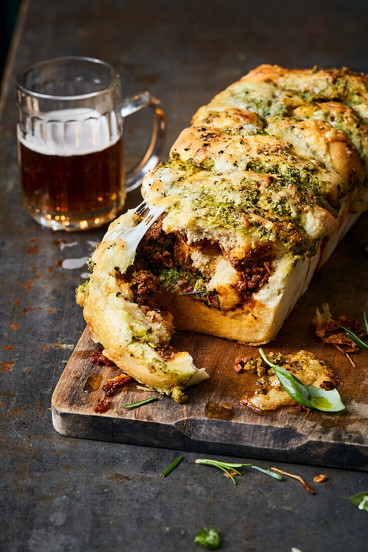 Pull-apart bread filled with pesto, mozzarella and bolognese