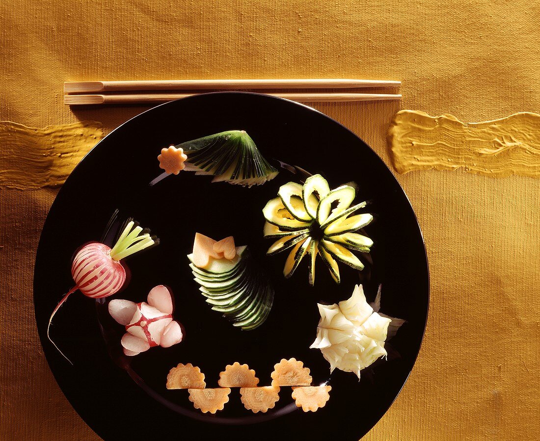 Asian vegetable carvings on plate