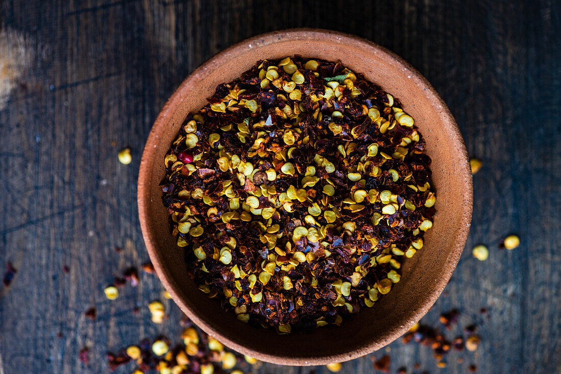 Organic pepper spice on rustic background