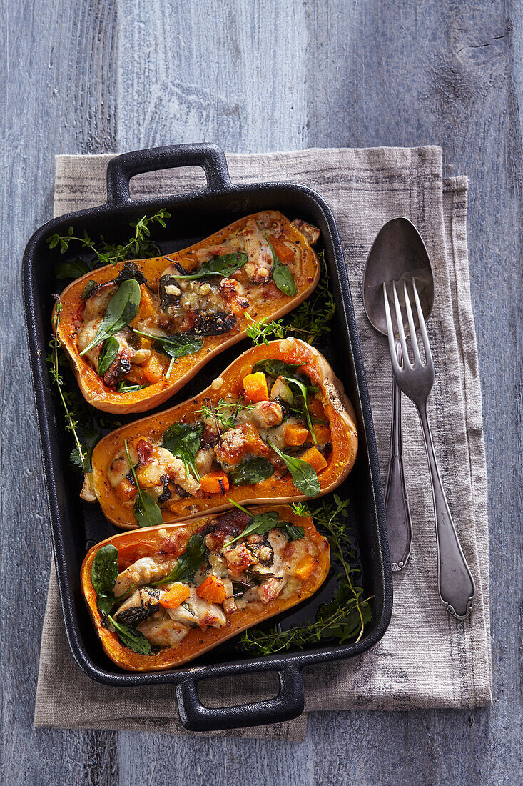 Gratinated butter pumpkin with cheese and spinach