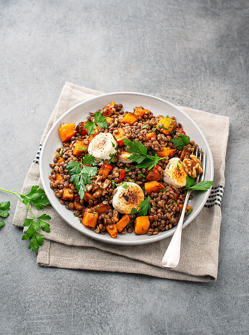 Pumpkin and lentil salad with goat cheese and walnuts