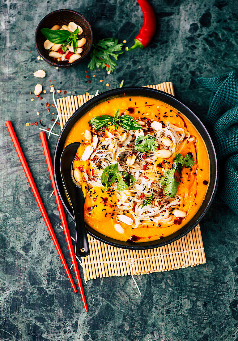 Pumpkin soup Asia Style with coconut milk, ginger and rice noodles