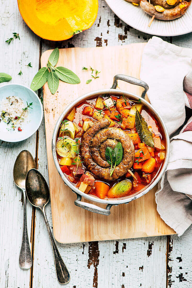 Potato and pumpkin soup with sausage snails