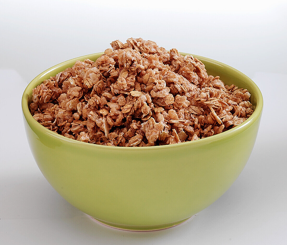 A bowl of Granola on a white background