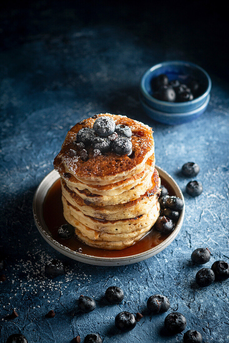 Chocolate Chip Pancakes with Blueberries, Maple Syrup and Powdered Sugar