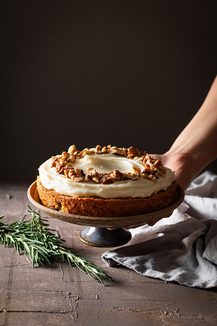 Carrot cake with walnuts in a rustic kitchen