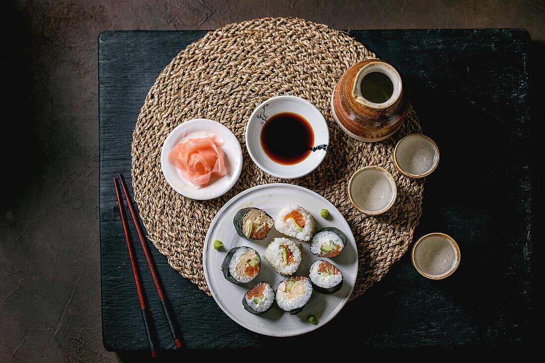 Homemade sushi rolls set with salmon, japanese omelette, avacado, ginger, soy sauce