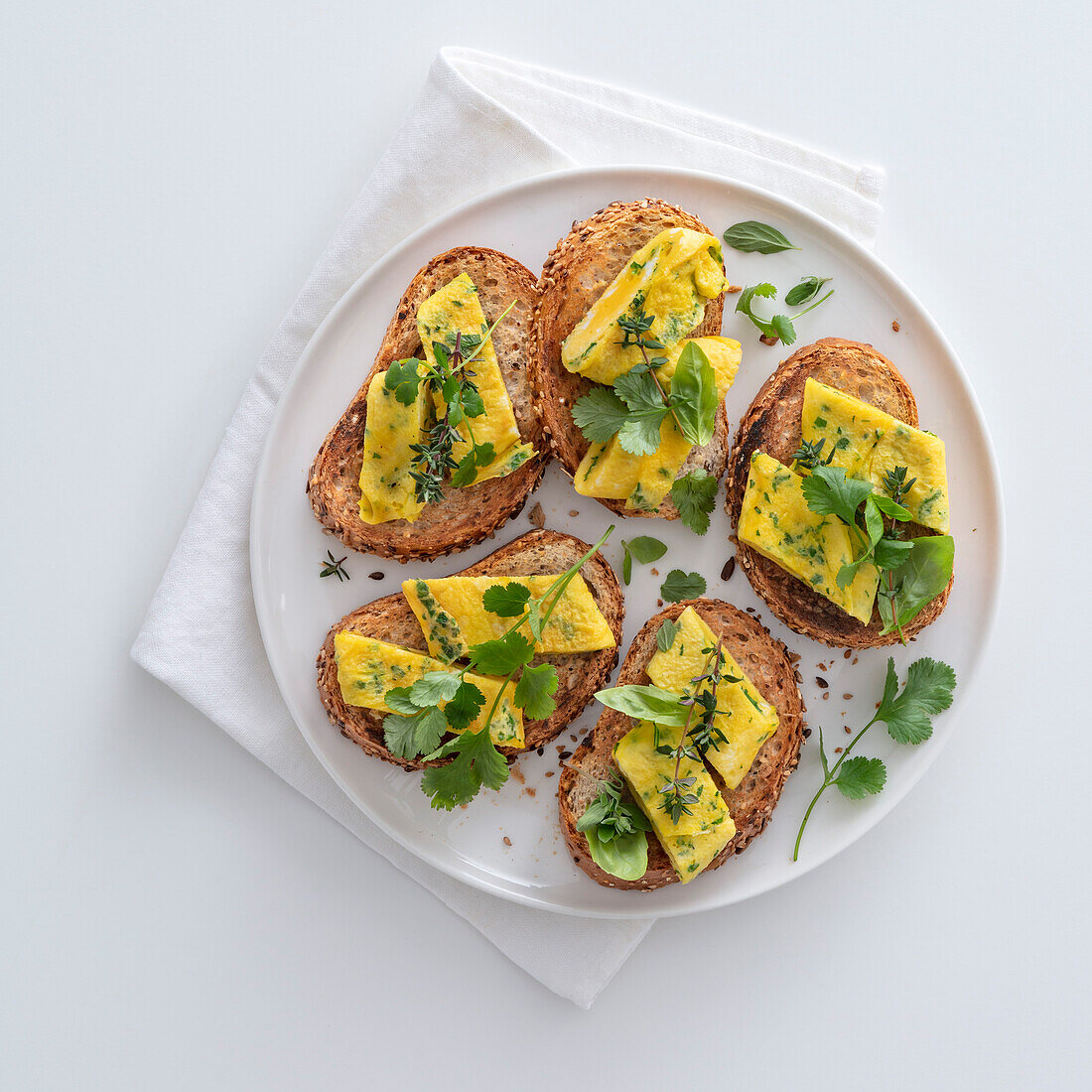 Crostini with omelet and herbs