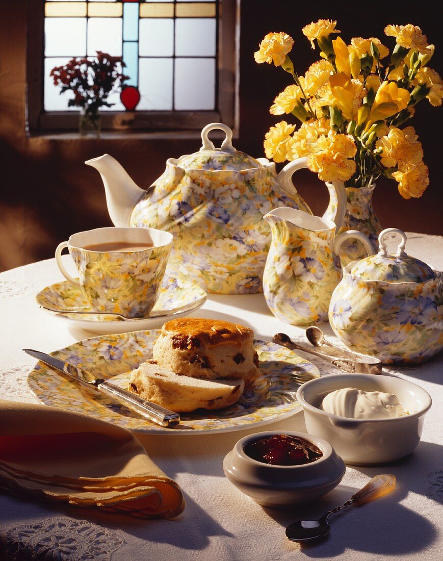 English tea scene, raisin scones, jam and clotted cream