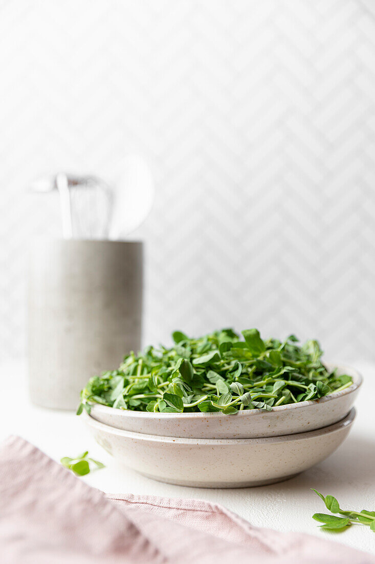Pea shoots in a ceramic bowl