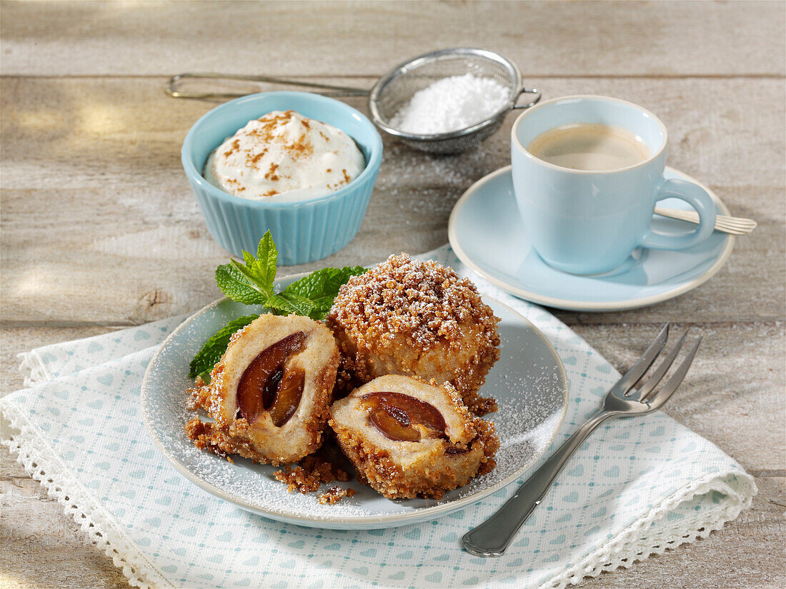 Plum dumplings in browned breadcrumbs