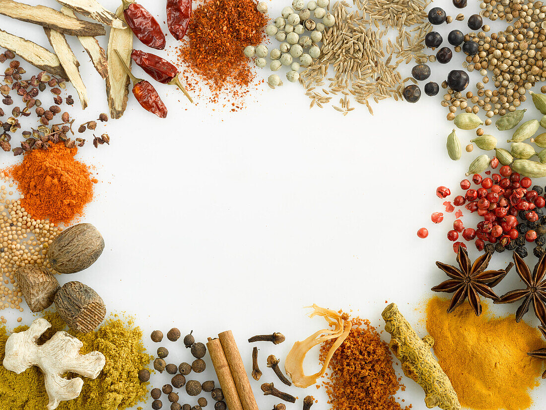 Various spices arranged around the edge of the picture