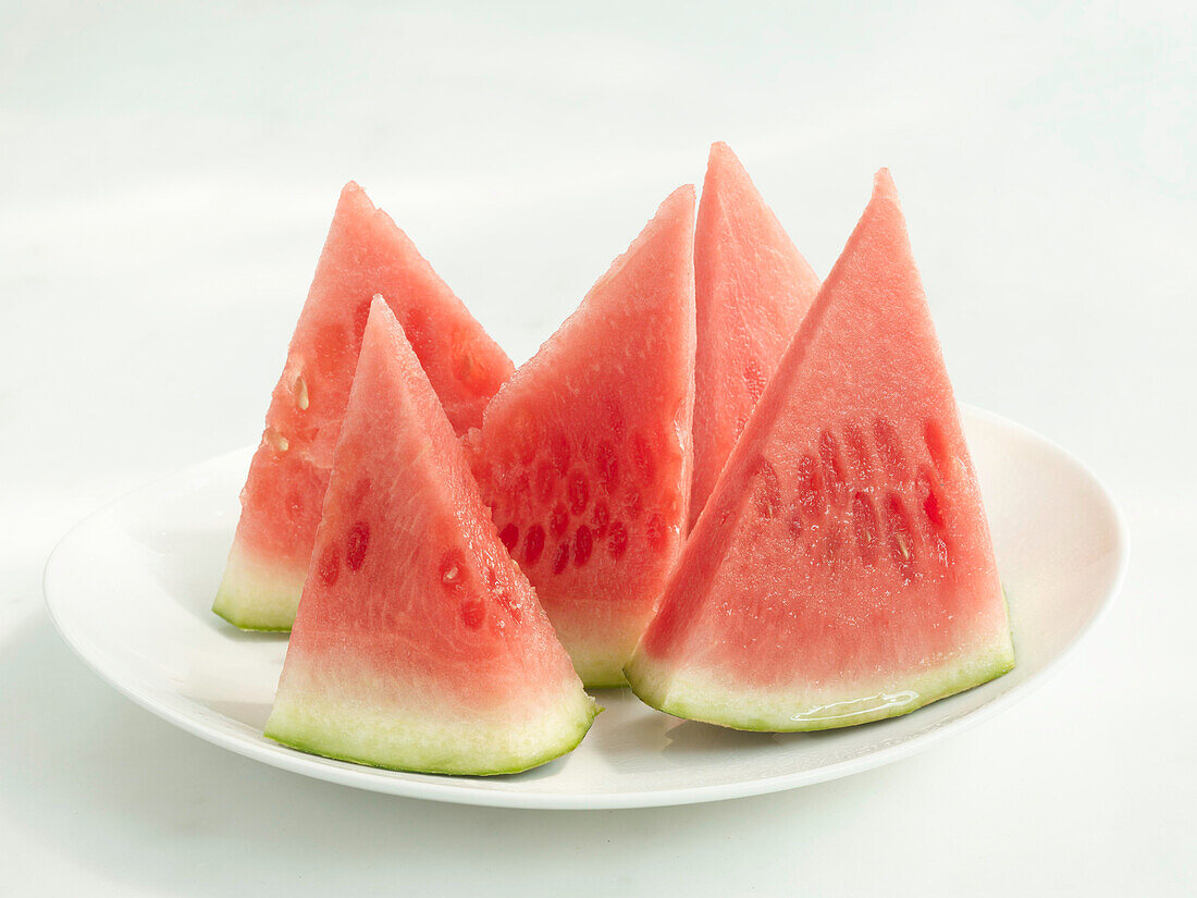 Triangular pieces of watermelon on a plate