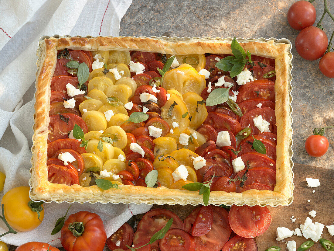 Tomato puff pastry quiche with chili, feta, and basil