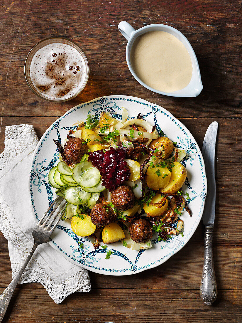 Vegetarian metaballs, pickled cucumber, lingonberries, creamy sauce, potatoes, fennel