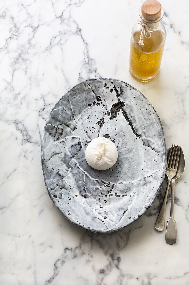 Burrata on a marbled plate