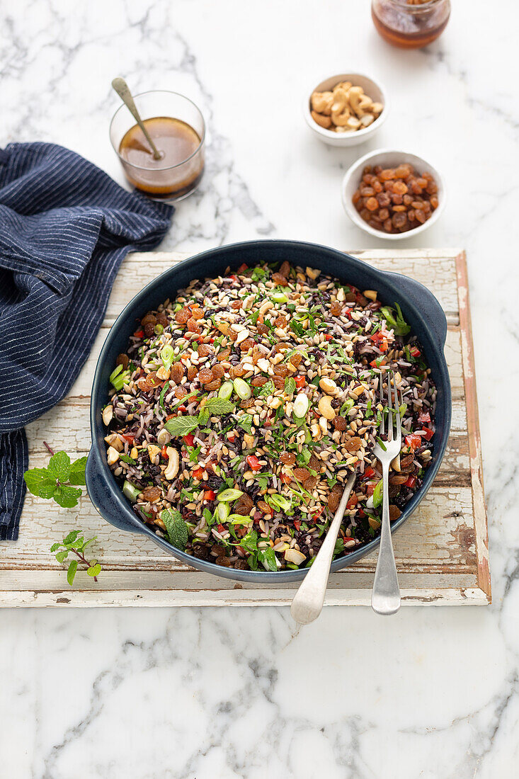 Rice salad with sunflower seeds, cashew nuts and sultanas
