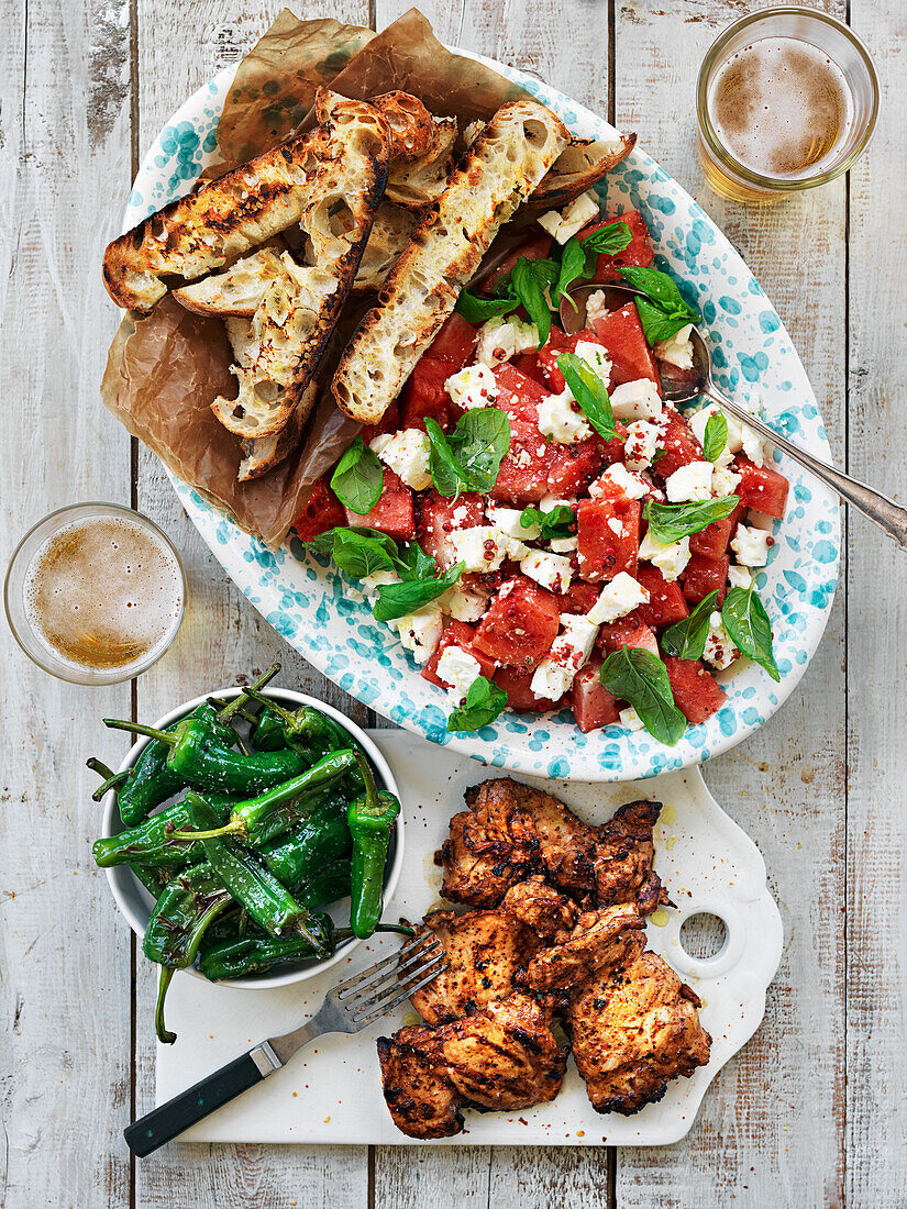 Grilled chicken, padron peppers, feta and watermelon salad with mint, grilled bread